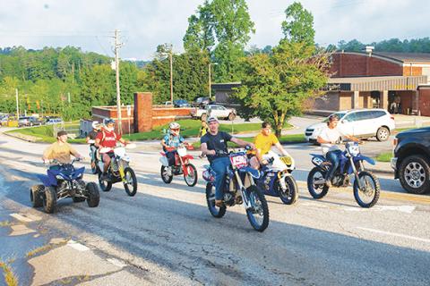 Photos by Michelle Bradbeer/Staff Corresponden: Murphy High School’s 2025 seniors made it loud in the early morning Thursday, as they cruised on their motorbikes with a few juniors through the drop-off area and parking lot on Senior Skip Day.