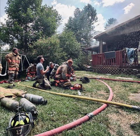 Randy Foster/editor@cherokeescout.com Cherokee Scout photo wins: This is the news winner of the First Quarter 2025 Publishers Auxiliary Photo Contest. Firefighters catch their breath after searching a burning house for any people inside. The fire occurred at 505 Haywagon Lane, just north of the Georgia state line. The house was deemed unsavable and burned to the ground.