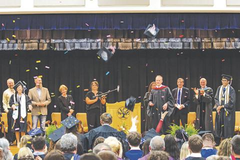 Cannon Crompton/sports@cherokeescout.com Tri-County Early College celebrates the Class of 2025 on Friday evening as confetti falls and caps fly.