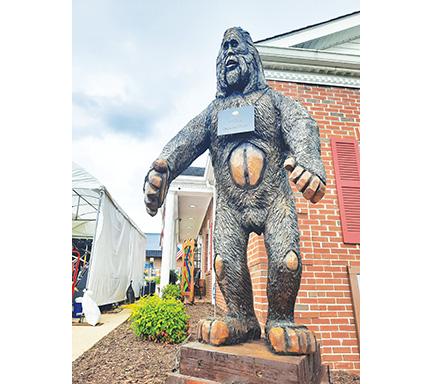 Anngee Quinones-Belian/Staff Correspondent After weeks of chainsaw carving, hard work and dedication, the 10-foot-tall, 700-pound Bigfoot, “Arty MacMurphy,” stands tall Friday night at the Murphy Art Center downtown.