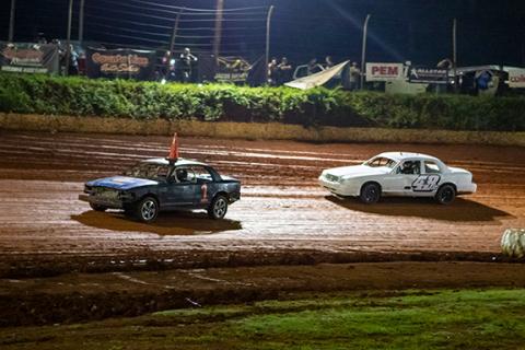 Cannon Crompton/sports@cherokeescout.com Zack Meinders (left) leads Jim Exum in the Crown Vic classification Friday night. 