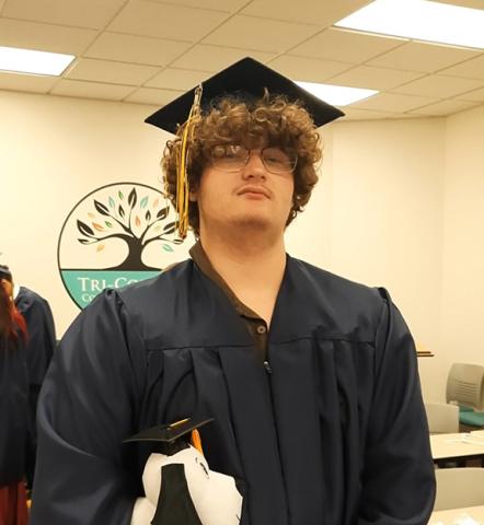 Anngee Quinones-Belian/Staff Correspondent  Wayne Crow of The Oaks Academy, worked hard to be able to walk across the stage a year early Thursday. He plans to have a career in electrical engineering.