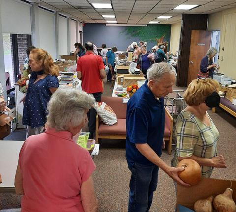 Anngee Quinones-Belian/Staff Correspondent   The annual arts and crafts sale at the Murphy Public Library always draws a crowd. The sale helps raise money for needed library items, while keeping prices low for shoppers.