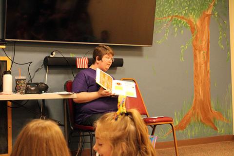 Photos by Stacy Van Buskirk/Staff Correspondent “Miss Bridget” Wilson captivates a group of young listeners during storytime at the Murphy Public Library on June 16. 