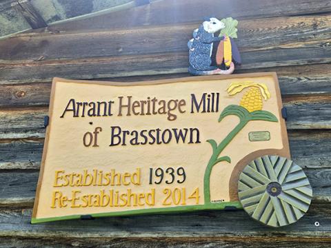 Photos by Stacy Van Buskirk/Staff Correspondent The sign for the Arrant Heritage Gristmill is hand-carved by Stacie Gilmore of Brasstown. Gilmore carved the sign from maple and poplar, using acrylic paints for color.