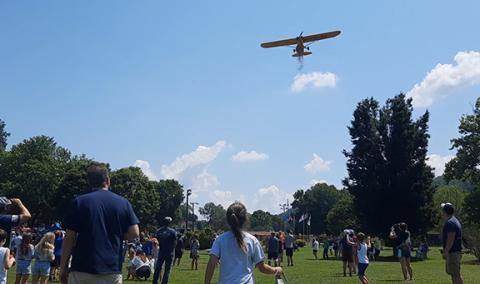 Photos by Anngee Quinones-Belian/Staff Correspondent Thousands of peanuts peppered the Konehete Veterans Park ball field for the annual July 4th Hometown Celebration in Murphy. Folks were running around, sometimes into each other, in search of the snack and cash prizes.