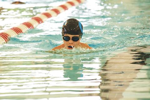 Cannon Crompton/sports@cherokeescout.com Elijah Whitney competes in the 50-yard breaststroke in Cherokee County Aquatic Club’s home swim meet on July 1. 