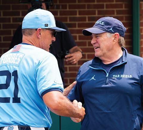 Carolina Football Facebook UNC-Chapel Hill baseball head coach Scott Forbes (left) shares a moment with head football coach Bill Belichick prior to the NCAA Super Regional game against Arizona in Chapel Hill on June 7.