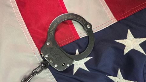 A last tribute: The handcuffs belonging to Cherokee County Transport Detention Officer Francisco Flattes were eventually placed on his assailant.