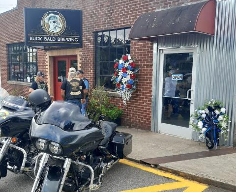 Memorial wreaths placed at the entrance of Buck Bald Brewing on Aug. 2 honored Francisco Flattes and other law enforcement officers killed in the line of duty.
