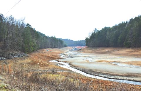 Randy Foster/editor@cherokeescout.com The shores of Hiwassee Lake are shown during a low-level period. The Tennessee Valley Authority adjusts the lake level for flood control downriver of Hiwassee Dam. A push to transfer the Hanging Dog campground from U.S. Forest Service to state parks management is being thwarted in part by fluctuating lake levels.