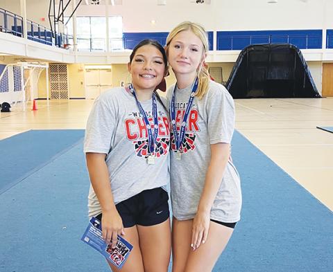 Andrews seniors Kaiya Ellis (left) and Daisy Sargent tried out and qualified for All-American Cheer. 