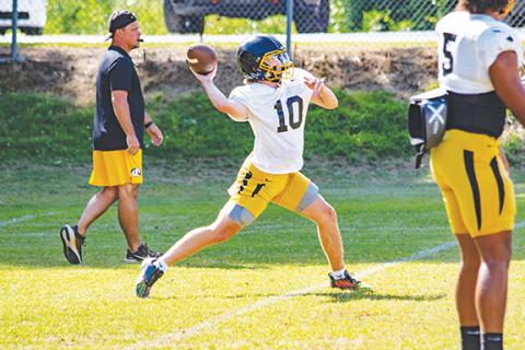 Cannon Crompton/sports@cherokeescout.com Murphy quarterback Brady Grant throws a pass downfield during training camp.