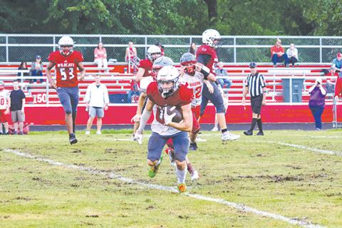 Cannon Crompton/sports@cherokeescout.com Andrews’ Kelby Waldroup breaks free to run for a first down during the Wildcats’ scrimmage against Copper Basin, Tenn., on Friday. 