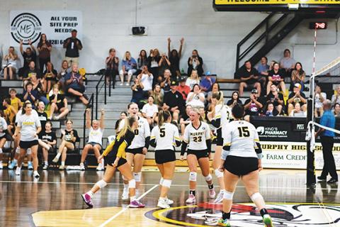 Cannon Crompton/sports@cherokeescout.com The Murphy Lady Bulldogs varsity volleyball team celebrate scoring a point in their win against Rosman on Aug. 12.