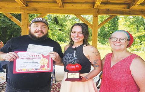 Nocturnal Brewing took home first place in this year’s Professional category in the third annual Tomato Fest Bloody Mary contest Saturday. From left are bar manager Nathan Paxton, lead server Julia Hungerford and Cherokee Clay Food Alliance Executive Director Megan Lambert. Held annually during National Farmers Market Week in conjunction with Murphy Farmers Market, the contest features local restaurants offering their best drink recipes. 