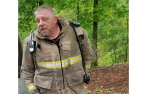 Anngee Quinones-Belian/Staff Correspondent  Grape Creek Fire Chief Alan Andrews needs a little help. A countywide boot drive is being held Saturday. 