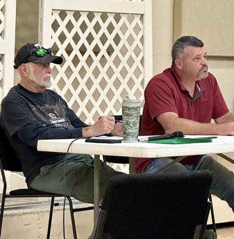 Aiden McCoy Williams/Staff Correspondent Commissioners Dan Eichenbaum and Alan Bryant (from left) listen to local residents during a Chairman’s Forum at the Unaka Community Center on Aug. 4.