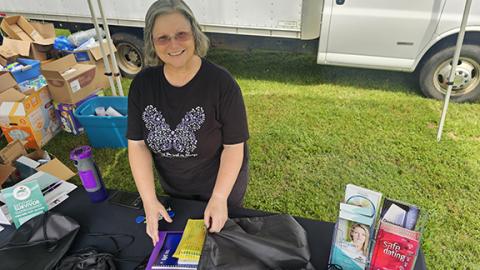 Photos by Nicole Wright/Staff Correspondent Reach of Cherokee & Graham Counties advocate Renee Deweese shows off the back to school backpacks with crayons and notebooks offered at the Back to School Pool Party on Saturday at Andrews Recreation Park. The school supplies were offered free to families during Saturday’s event. Sponsored by the Andrews Housing Authority, Reach of Cherokee County and the Town of Andrews, families were encouraged to come enjoy the last days of freedom and summer before the school 