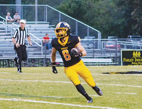 Cannon Crompton/sports@cherokeescout.com Murphy’s Blake Davis rushes for yardage against East Surry on Sept. 5. 