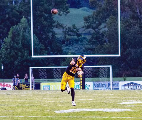 Cannon Crompton/sports@cherokeescout.com Murphy quarterback Brady Grant throws a deep ball against East Surry on Sept. 5.
