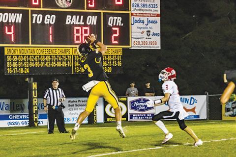 Cannon Crompton/sports@cherokeescout.com Ryan Payne of Murphy gets an interception as time expires in the first half against East Surry on Friday night. 