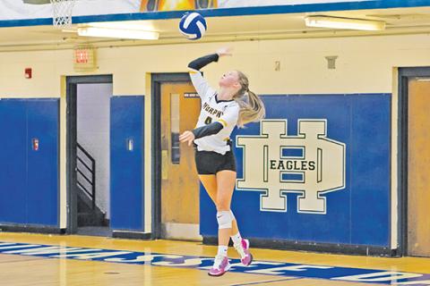Cannon Crompton/sports@cherokeescout.com Murphy’s Saddie Cornwell serves against Hiwassee Dam during their match on Sept. 9.