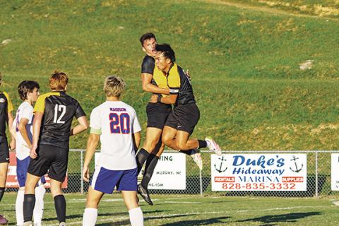 Cannon Crompton/sports@cherokeescout.com Elijah Twiggs (left) and Jerry Bui of Murphy celebrate Twiggs’ first-half goal against Madison on Sept. 10. 
