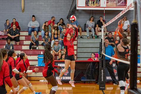 Cannon Crompton/sports@cherokeescout.com Andrews Lady Wildcat Lauren Cochran knocks the ball over the net against Rosman on Thursday. 