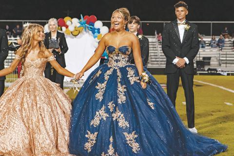 Cannon Crompton/sports@cherokeescout.com Senior Emma Laney reacts to the announcement that she is the 2025 Murphy High School homecoming queen Friday night on David Gentry Field. See every member of the Bulldogs’ homecoming court on page 12A.