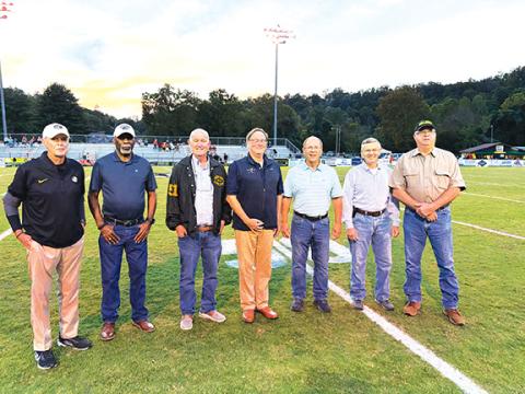 Brandon Stephens/ Contributing Photographer  Players from the 1974 Murphy football team Class of 1975 got back together for the 50th anniversary of the Bulldogs’ state 2A championship and attended the homecoming game Friday night. Pictured are (from left) assistant coach Wayne Watson, Willie Brown, Nolan Smith, Phil Dickey, Chris McConnell, Tim Meyers and Kenny Hall. In the 1974 season, the Dogs defeated Robersonville to win the state title. In that game, Willie Brown broke the state’s all-time rushing reco