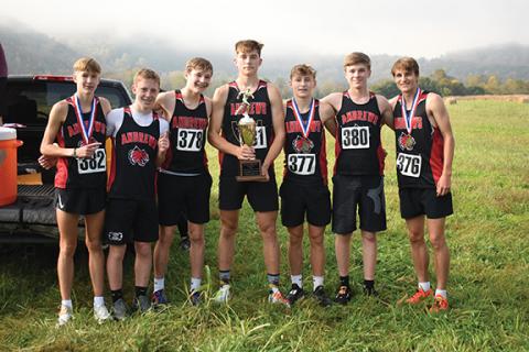 Kevin Hensley/The Graham Star The Andrews boys cross-country team holds the Smoky Mountain Conference championship trophy after winning the meet Saturday. The team (from left) is Elliott Salinas, Jayce Donaldson, Luke Clark, Myca Mustin, Levi Clark, Ethan Garrett and Gabe Clark.