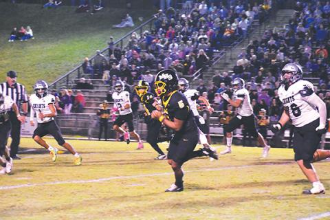 Kevin Hensley/The Graham Star Cameron Clem of Murphy breaks free for yardage against Robbinsville on Friday night.