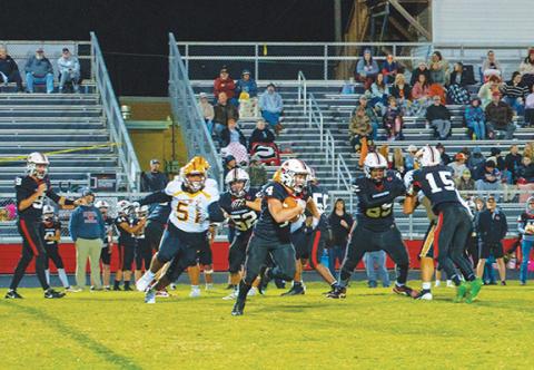 Michelle Bradbeer/Staff Correspondent Andrews senior O’Malley Salinas breaks free for yardage against Cherokee on Friday night. 