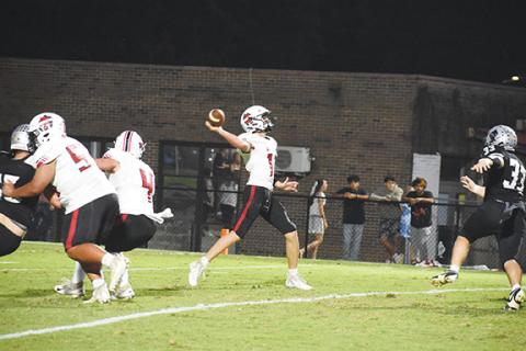 Kevin Hensley/The Graham Star Andrews quarterback Logan Shuler throws downfield to a receiver during their game against Robbinsville on Friday.