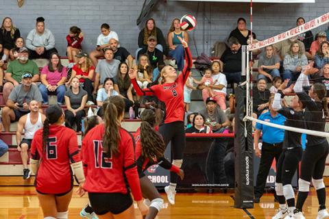 Cannon Crompton/sports@cherokeescout.com Lauren Cochran of Andrews knocks the ball over the net in their match against Robbinsville on Aug. 28. 