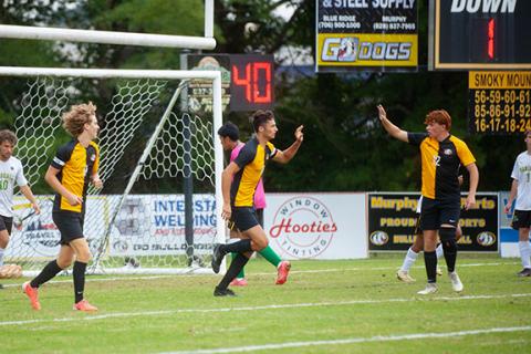 Michelle Bradbeer/Staff Correspondent Elijah Twiggs (left) of Murphy celebrates with Andrew White after scoring a goal against Blue Ridge Early College on Sept. 24. 