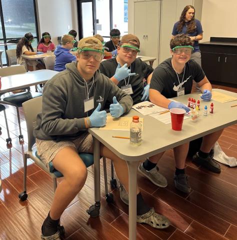 Luke Buckner, Tucker Moore and Caden McClure (from left) are among the Hayesville Middle School eighth-grade students who visited Tri-County Community College campus on Oct. 16 to experience hands-on science exploration through the NCBioNetwork’s EASE – Effective Authentic Science Event – program at the college.