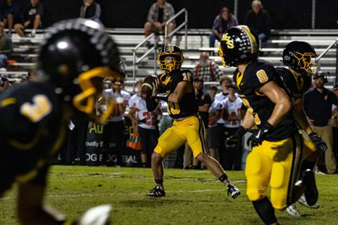 Murphy quarterback Brady Grant looks to the end zone to set up a touchdown pass for the Dogs on Oct. 3 against Rosman.