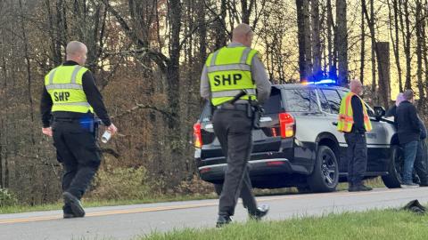 Highway Patrol troopers investigate a fatal crash on Airport Road on Monday afternoon. 