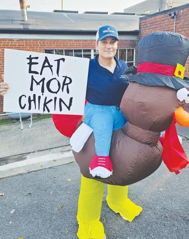 Rotary member Gio Castiglione displays his recruitment technique during the Rotary Club of Murphy’s third annual Gobble Gallop on Saturday at Buck Bald Brewing.