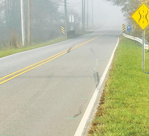 Randy Foster/editor@cherokeescout.com Skid marks show the path of a vehicle that struck and killed a bicyclist on Airport Road in Marble on Nov. 3.
