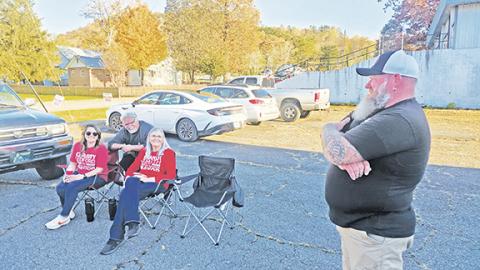 Nicole Wright/Staff Correspondent From left, Chasity Ledford, Mayor James Reid and Alderwoman Brandi Smith share a smile outside the Andrews Facilities Building during the Nov. 4 municipal elections.