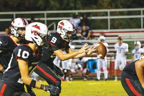 Cannon Crompton/sports@cherokeescout.com Andrews quarterback Brady McLelland gets the ball against Anderson on Sept. 12. 