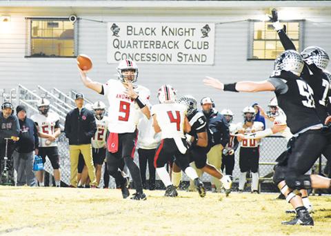 Kevin Hensley/The Graham Star Andrews quarterback Brady McLelland (No. 9) throws the ball in the second-round state 1A playoff game against Robbinsville on Friday night.