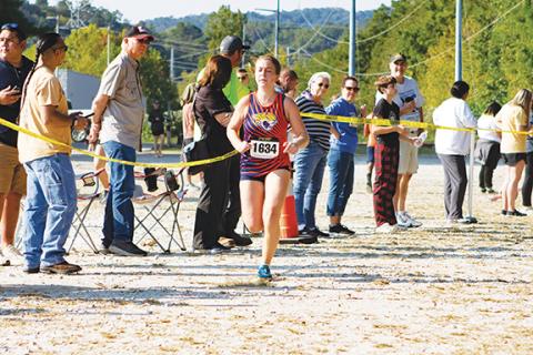 Cannon Crompton/sports@cherokeescout.com State 1A champion Fern Crayton of Tri-County Early College runs toward the finish line during a race at Murphy earlier in the season on Sept. 20. 