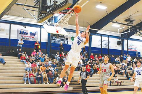 Cannon Crompton/sports@cherokeescout.com Jonah Dockery of Hiwassee Dam goes up to bury to ball in the hoop during the Eagles’ game against Copper Basin, Tenn., on Nov. 18.