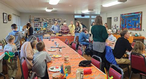 Photos by Nicole Wright/Staff Correspondent Congregants, family and friends of Darlene Heaton’s Montessori class enjoy a traditional Potlatch celebration in the fellowship hall of Andrews Presbyterian Church on Oct. 31. In its 28th year, the celebration honors First Nations culture; Heaton’s class made beaded necklaces and offered gifts to family, who attended in keeping with the tradition.