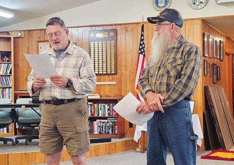Photos by Nicole Wright/Staff Correspondent Keith Rogers (left) reads the Marine Corps Commandant Gen. Eric Smith’s birthday message at the Andrews VFW Post 7620’s celebration Nov. 10. Local post commandant Scott Ramler (right) read the original birthday celebration message from Nov. 10, 1921, known as the Lejeune message, written by Major Gen. John Lejeune. Since that first celebration, which stemmed from the Corps’ installment as the Continental Marines on Nov. 10, 1775, the branch’s birthday has been cel
