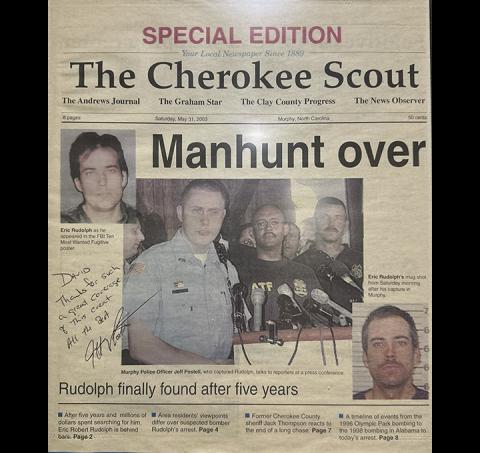 More than 50,000 copies of the Cherokee Scout’s special section on fugitive Eric Rudolph’s arrest in May 2003 were distributed in several newspapers across western North Carolina and northern Georgia. This copy – which was signed by Jeff Postell, the former Murphy police officer who made the arrest – is hanging in the Scout’s office.